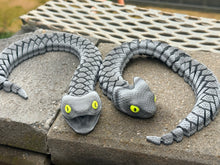 Grey articulated snake
