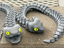 Grey articulated snake